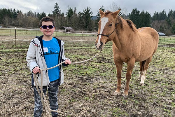 Gersh Academy Student and a Horse Engaging in Equine Therapy