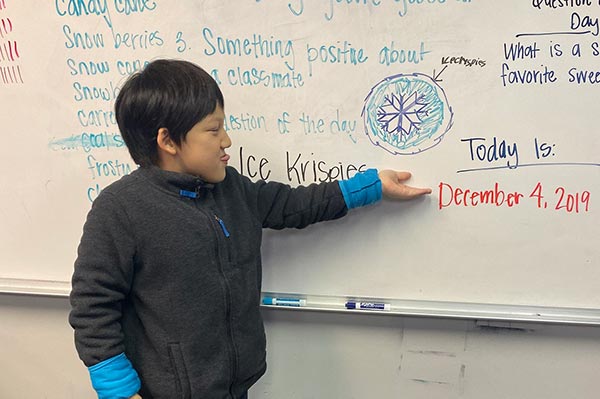 Gersh Academy Student Presenting at the Chalk Board